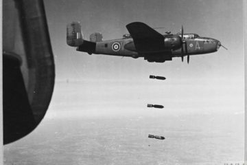 North American Mitchell II, No. 98 Squadron, unloads its bombs on a daylight mission.